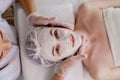 Woman in moisturizing anti-wrinkle mask. A woman is lying down, resting in a beauty salon. SPA procedures at home or in