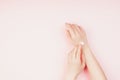 Woman moisturizing her hand with cosmetic cream Royalty Free Stock Photo