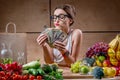 Woman with money cash and healthy food Royalty Free Stock Photo