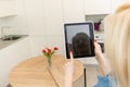 Woman monitoring cameras Live view on the tablets display. Home security system concept Royalty Free Stock Photo