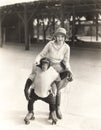 Woman with monkey on roller skates Royalty Free Stock Photo