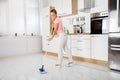 Woman With Mop Standing In The Kitchen Royalty Free Stock Photo