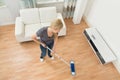 Woman Mopping Floor Royalty Free Stock Photo