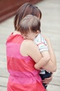 Woman mother comforting her crying little toddler boy son Royalty Free Stock Photo