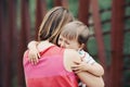 Woman mother comforting her crying little toddler boy son Royalty Free Stock Photo