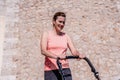 Woman, mother doing fitness pushing the baby stroller Royalty Free Stock Photo