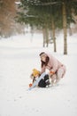 Woman mother helps her child stand children& x27;s skis Royalty Free Stock Photo