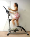 Woman in Motion on Elliptical