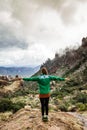 Woman on mountain admiring majestic landscape in Arizona, USA