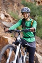 Woman, mountain bike and portrait with smile, adventure and helmet for safety, fitness and health. Girl, bicycle and Royalty Free Stock Photo