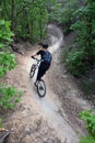 Woman mountain biker / s-curve