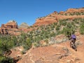 Woman mountain biking in the red rocks, Sedona, USA Royalty Free Stock Photo