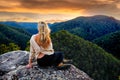 Woman mountain gazing at sunset Royalty Free Stock Photo