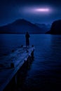 woman and mountain lake at night mysterious star moon sky Royalty Free Stock Photo