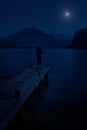 woman and mountain lake at night mysterious star moon sky Royalty Free Stock Photo