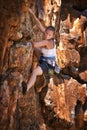 Woman, mountain and rock climbing for exercise in outdoors, challenge and rope for training. Female person, cliff and Royalty Free Stock Photo