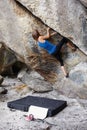 Woman, mountain and rock climbing hanging exercise in cliff for adventure, fitness or extreme sport. Female person Royalty Free Stock Photo