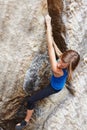 Woman, mountain and rock climbing or hanging outdoor for .strong exercise on cliff adventure, fitness or extreme sport Royalty Free Stock Photo