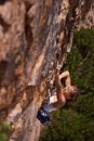 Woman, mountain and strong for rock climbing in outdoors, challenge and rope for training. Female person, cliff and