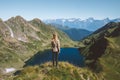 Woman on mountain top enjoying lake view hiking travel adventure outdoor healthy lifestyle summer vacations Royalty Free Stock Photo