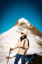 woman mountaineer and model posing in snowy mountain landscape. warm for the cold. french pyrenees Royalty Free Stock Photo