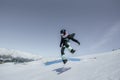 Woman in the mountains practicing snowboard Royalty Free Stock Photo