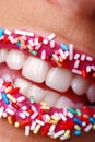 Woman mouth with colored candy Royalty Free Stock Photo