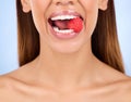 Woman, mouth and raspberry for skincare nutrition, dermatology or diet health plan against a studio background. Female Royalty Free Stock Photo