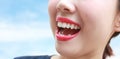 Woman mouth smile with great teeth over blue background. Royalty Free Stock Photo