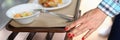 Woman move food tray in self-service restaurant. Royalty Free Stock Photo