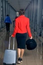 Woman is on the move with a suitcase