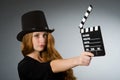 Woman with movie clapboard against Royalty Free Stock Photo