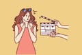 Woman movie star is embarrassed sees clapboard passing casting call for role in popular series Royalty Free Stock Photo