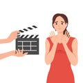 Woman movie star is embarrassed sees clapboard passing casting call for role in popular series or tv show. Movie star girl waving Royalty Free Stock Photo