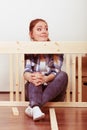 Woman moving in assembly furniture at new home. Royalty Free Stock Photo