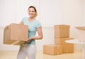 Woman moving cardboard boxes