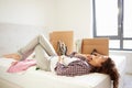 Woman Moving Into New Home Talking On Mobile Phone Royalty Free Stock Photo