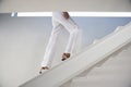 Woman Moving Upstairs In Modern Home