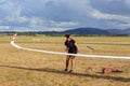 A woman moving the wing of a glider aircraft Royalty Free Stock Photo