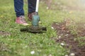 Woman mows the grass with a grass trimmer. Hobby and gardening