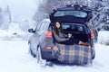 Woman with mug of hot drink in winter forest Royalty Free Stock Photo