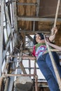 Woman in a multicolored blouse and blue jeans Royalty Free Stock Photo