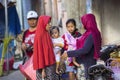 woman Muslim with chidren at the market, village Toyopakeh, Nusa Penida June 22. 2015