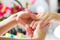 Woman in nail salon receiving hand massage Royalty Free Stock Photo