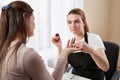 Woman getting a manicure at the nail salon