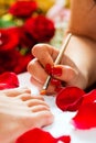 Woman in nail studio receiving pedicure Royalty Free Stock Photo