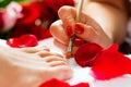 Woman in nail studio receiving pedicure Royalty Free Stock Photo