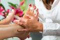 Woman in nail studio receiving pedicure Royalty Free Stock Photo