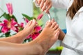 Woman in nail studio receiving pedicure Royalty Free Stock Photo