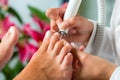 Woman in nail studio receiving pedicure Royalty Free Stock Photo